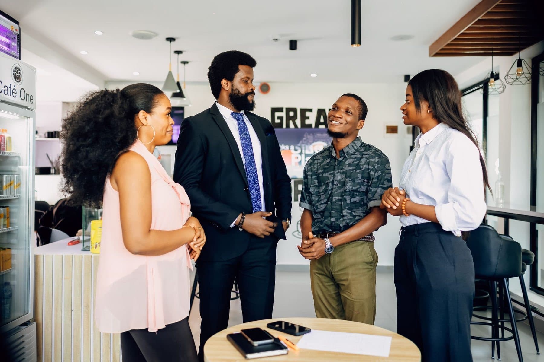 Business owners in conversation in a Lagos office